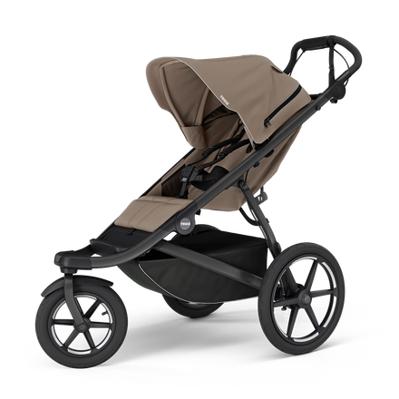 Thule Urban Glide 3 kinderwagen in Tinted Taupe met magnetische gesp, verkrijgbaar bij De Gele Flamingo.