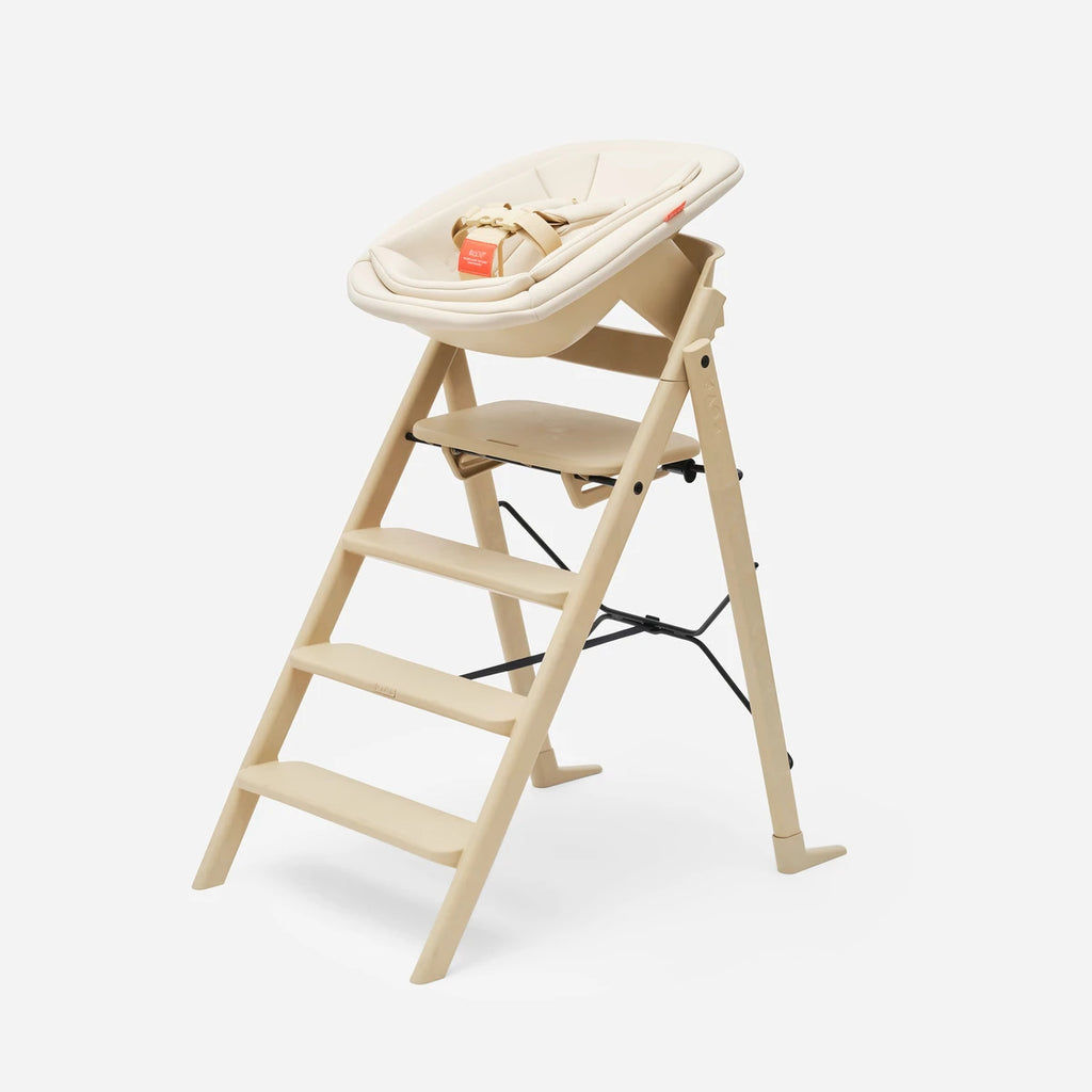 Kaos Newborn Baby Seat Desert Sand van De Gele Flamingo, geschikt voor baby's van 0 tot 12 maanden.