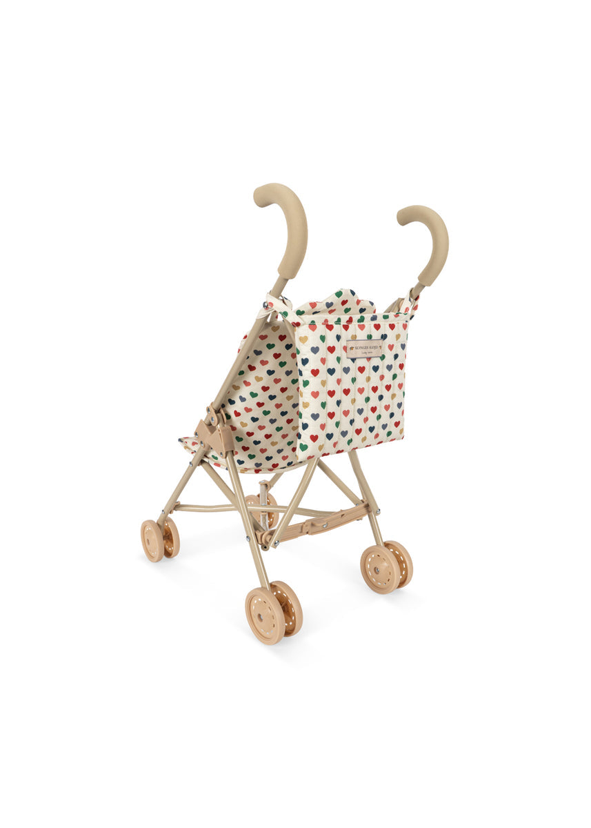 Konges Sløjd Poppenbuggy Doll Stroller Coeur Coloré, poppenbuggy op witte achtergrond