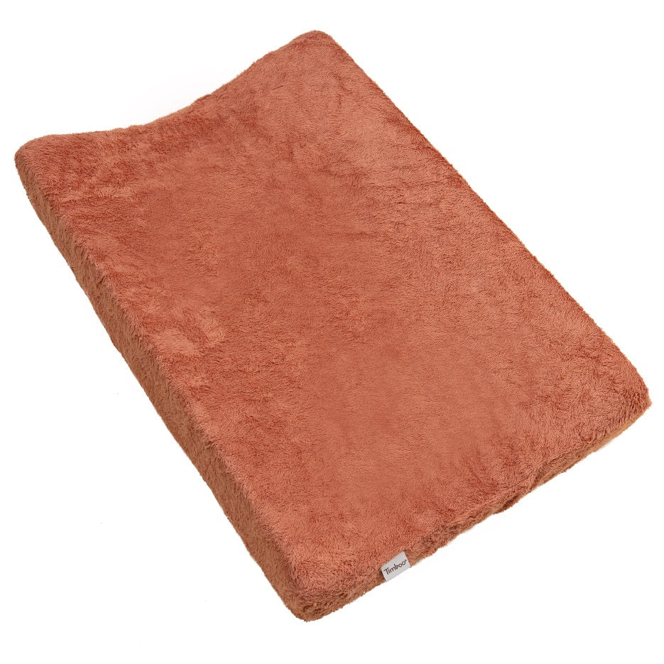 Timboo waskussenhoes Sunrise Orange, over een aankleedkussen gespannen