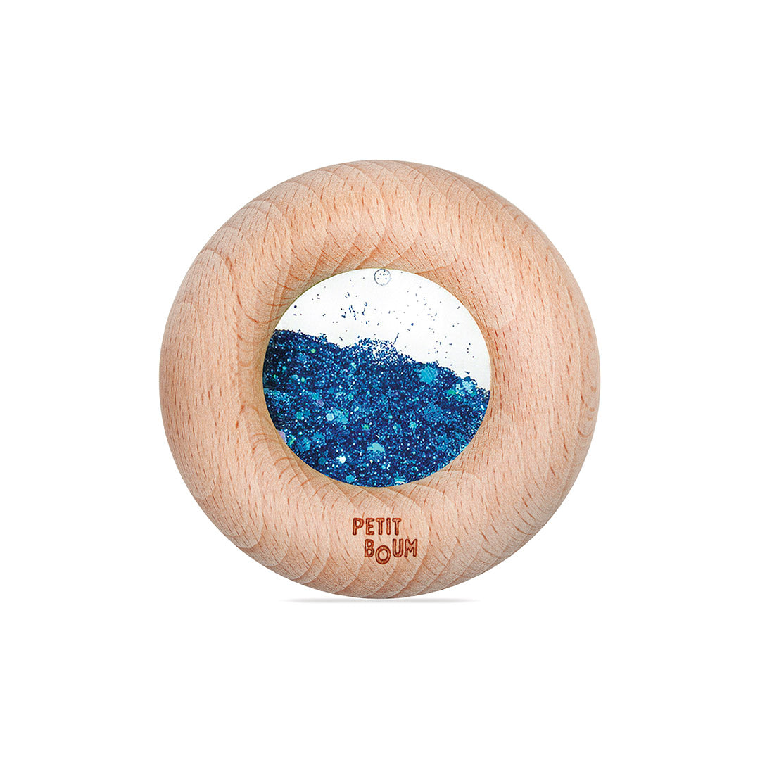 Petit Boum Sensorische Donut blauw, transparante donut gevuld met glitters, gevonden bij De Gele Flamingo.