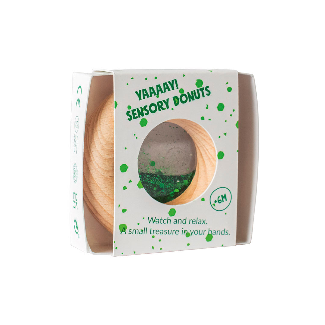 Petit Boum Sensorische Donut groen met glitters in de transparante ring, te koop bij De Gele Flamingo.