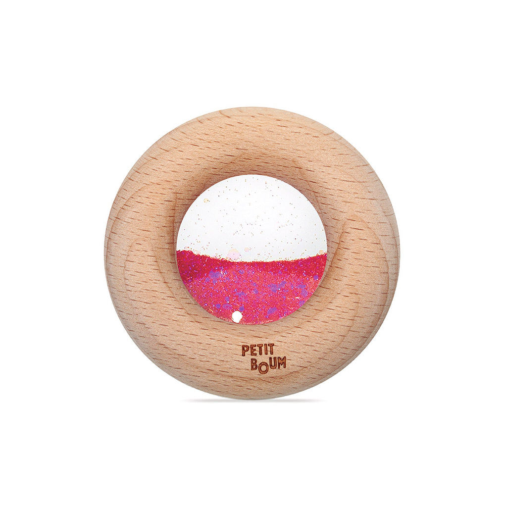 Petit Boum Sensorische Donut roos met zacht gerinkel bij elke beweging, verkrijgbaar bij De Gele Flamingo.