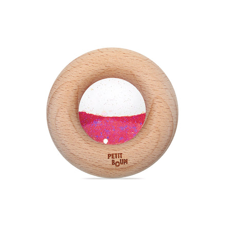 Petit Boum Sensorische Donut roos met zacht gerinkel bij elke beweging, verkrijgbaar bij De Gele Flamingo.